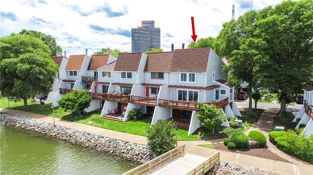 166 Mill Point Dr, Hampton, VA 23669 - rear view of house with a water view, a shingled roof, and a chimney