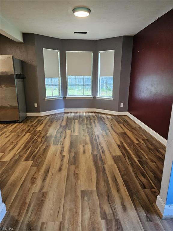 834 Haskins Dr, Suffolk, VA 23434 - spare room featuring wood finished floors and baseboards