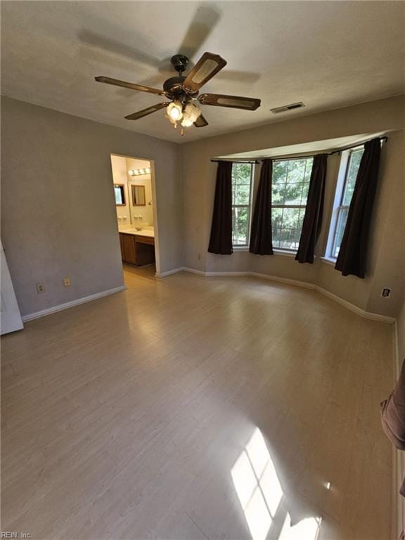 834 Haskins Dr, Suffolk, VA 23434 - spare room featuring baseboards, ceiling fan, and light wood-style flooring