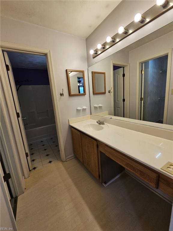 834 Haskins Dr, Suffolk, VA 23434 - full bathroom with vanity, wood finished floors, shower / tub combination, and baseboards