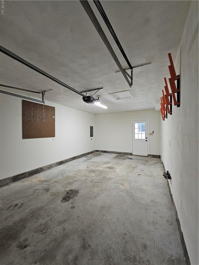 834 Haskins Dr, Suffolk, VA 23434 - garage with baseboards and a garage door opener