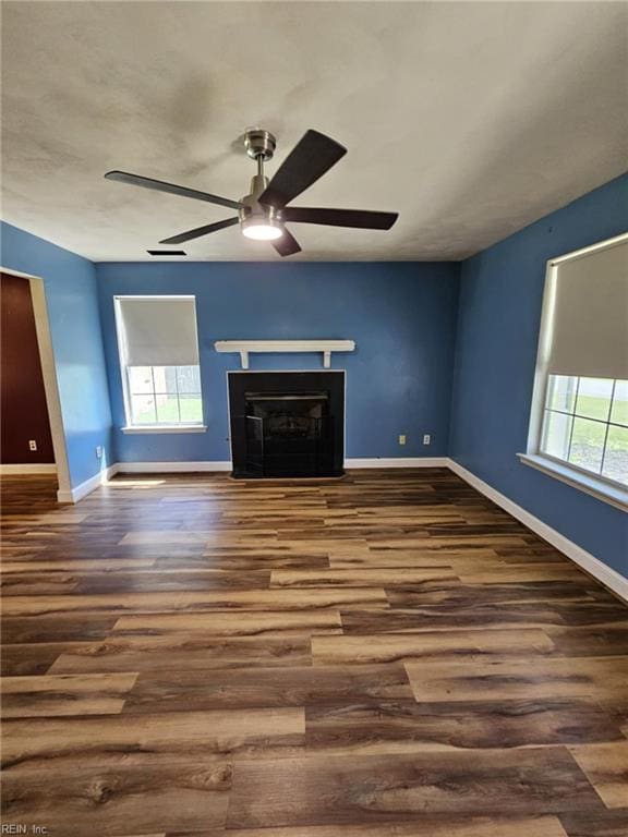 834 Haskins Dr, Suffolk, VA 23434 - unfurnished living room with a ceiling fan, baseboards, wood finished floors, and a fireplace