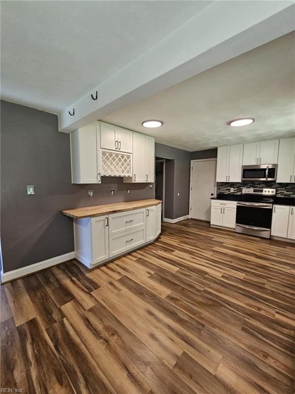 834 Haskins Dr, Suffolk, VA 23434 - kitchen with stainless steel appliances, baseboards, dark wood-style flooring, and white cabinetry