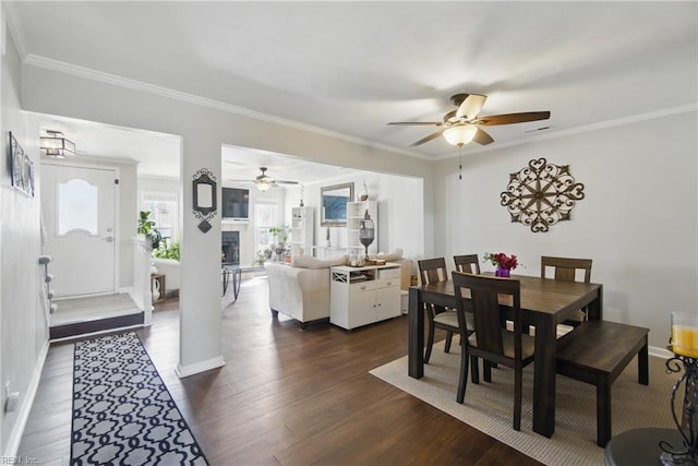 1765 Unicorn Dr, Virginia Beach, VA 23454 - dining room with ceiling fan, dark wood finished floors, ornamental molding, baseboards, and a fireplace