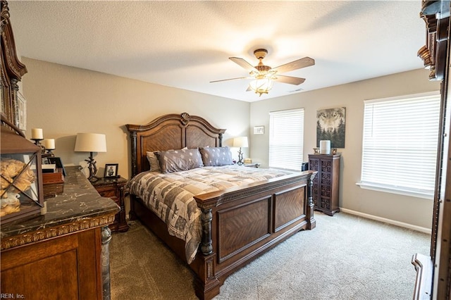 14387 Tucker Swamp Rd, Zuni, VA 23898 - carpeted bedroom featuring baseboards and ceiling fan