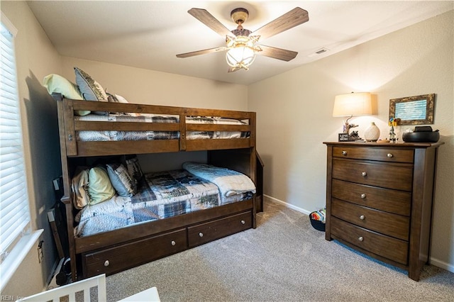 14387 Tucker Swamp Rd, Zuni, VA 23898 - carpeted bedroom featuring baseboards and a ceiling fan