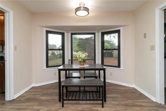 1238 Grenadier Dr, Chesapeake, VA 23322 - dining area with dark wood-type flooring and baseboards