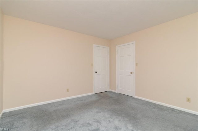 1238 Grenadier Dr, Chesapeake, VA 23322 - empty room with dark carpet and baseboards