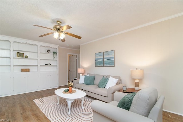 1238 Grenadier Dr, Chesapeake, VA 23322 - living room with wood finished floors, ceiling fan, and ornamental molding