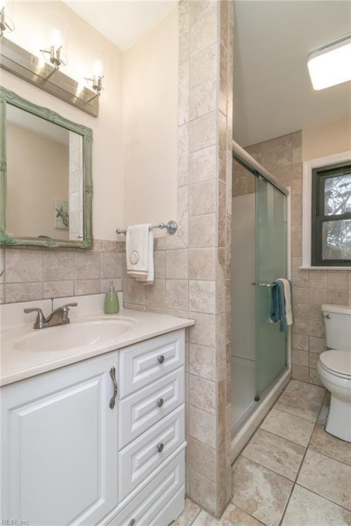 1238 Grenadier Dr, Chesapeake, VA 23322 - full bath featuring tile walls, vanity, toilet, a shower stall, and tile patterned flooring