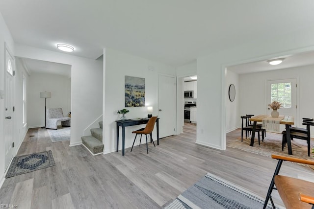 4401 Southampton Arch, Portsmouth, VA 23703 - foyer entrance featuring light wood-type flooring, baseboards, and stairs