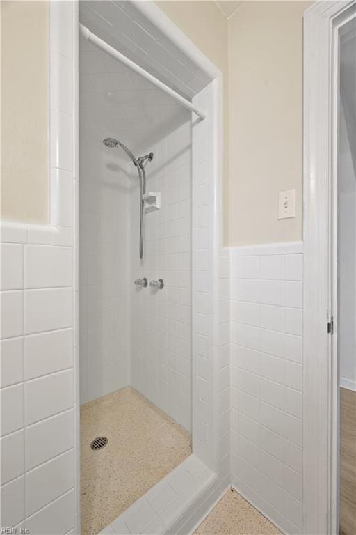 34 Kenwood Dr, Hampton, VA 23666 - bathroom with a shower stall, tile walls, and wainscoting