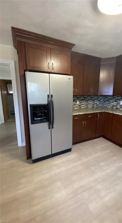 34 Kenwood Dr, Hampton, VA 23666 - kitchen with stainless steel fridge with ice dispenser, tasteful backsplash, light stone counters, and dark brown cabinets