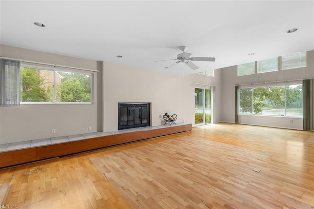 4249 Cheswick Ln, Virginia Beach, VA 23455 - unfurnished living room featuring wood finished floors, a ceiling fan, a glass covered fireplace, and recessed lighting
