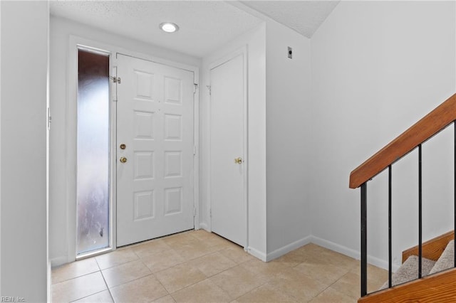 4321 Moosewood Ct, Virginia Beach, VA 23462 - entryway with light tile patterned floors, baseboards, and a textured ceiling