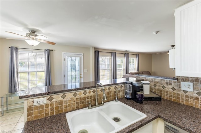 115 Rochdale Ln, Suffolk, VA 23434 - kitchen featuring a sink, open floor plan, backsplash, dark stone countertops, and a ceiling fan