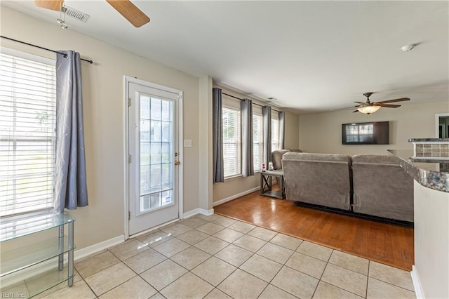115 Rochdale Ln, Suffolk, VA 23434 - living area featuring ceiling fan, light tile patterned flooring, and baseboards