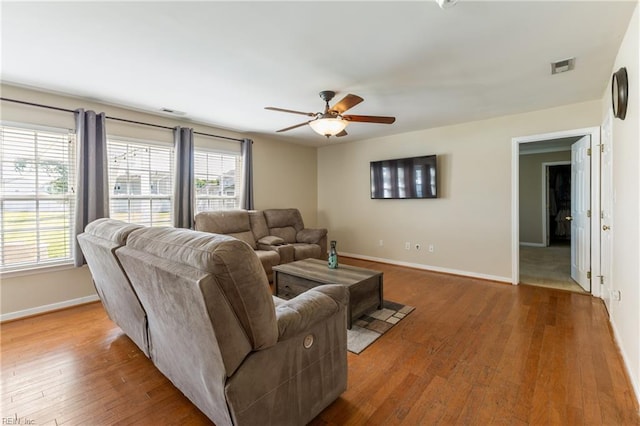 115 Rochdale Ln, Suffolk, VA 23434 - living area featuring a ceiling fan, baseboards, and wood finished floors