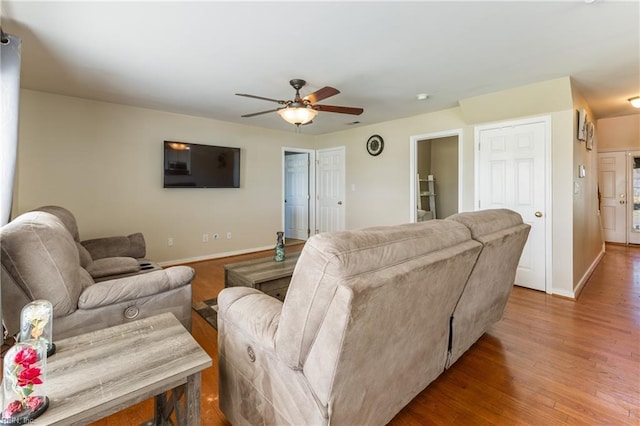 115 Rochdale Ln, Suffolk, VA 23434 - living room with a ceiling fan, baseboards, and wood finished floors