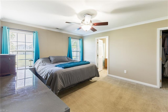 115 Rochdale Ln, Suffolk, VA 23434 - bedroom with ornamental molding, a walk in closet, light colored carpet, baseboards, and ceiling fan