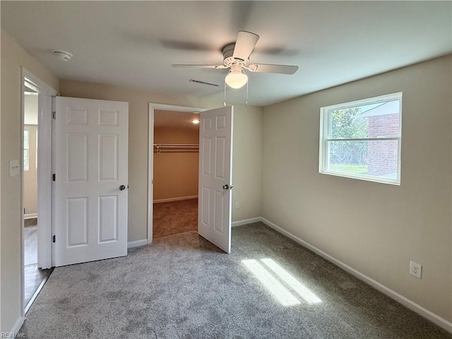2218 Andrews Blvd, Hampton, VA 23663 - unfurnished bedroom with carpet, a spacious closet, and baseboards