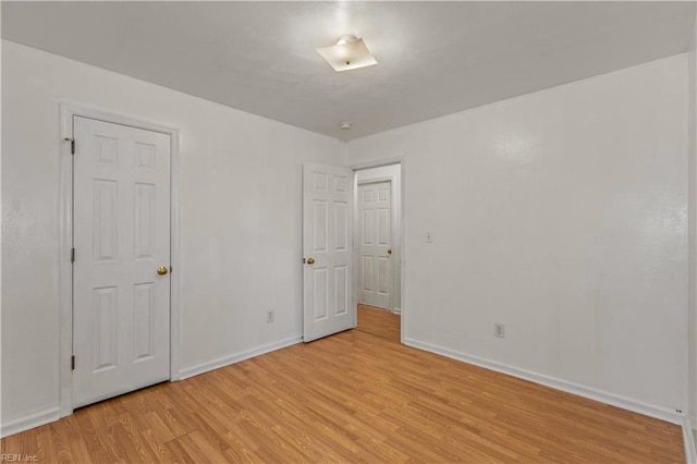 5036 John St, Chesapeake, VA 23321 - unfurnished bedroom featuring light wood-type flooring and baseboards