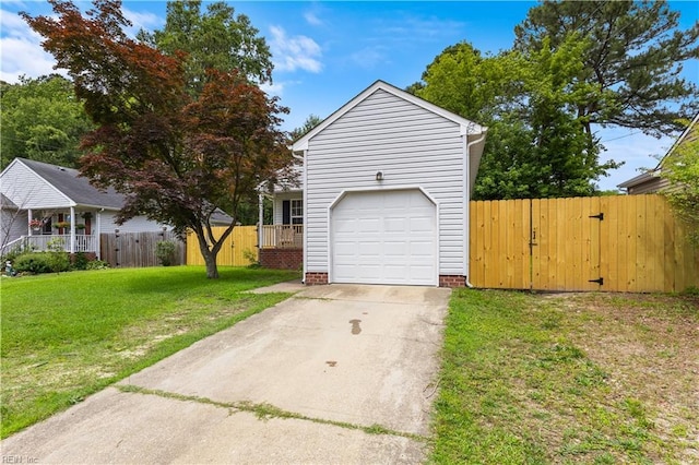 5036 John St, Chesapeake, VA 23321 - view of front of property featuring a garage, a gate, and driveway