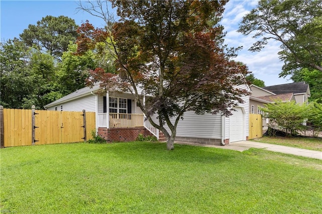 5036 John St, Chesapeake, VA 23321 - obstructed view of property with a gate, covered porch, concrete driveway, and an attached garage