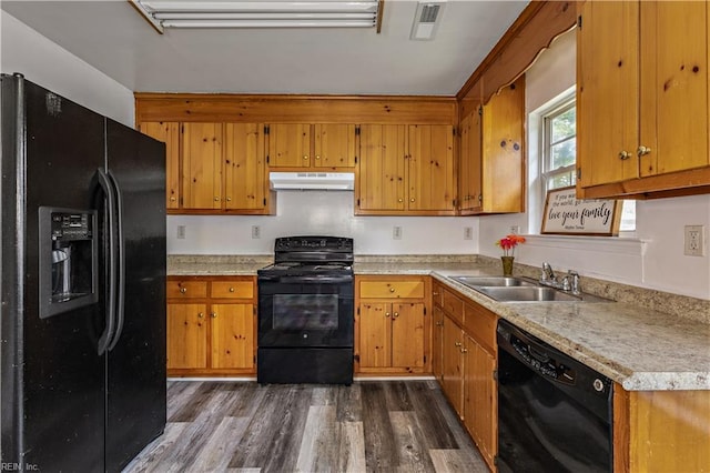 5036 John St, Chesapeake, VA 23321 - kitchen featuring black appliances, under cabinet range hood, a sink, dark wood-type flooring, and brown cabinetry