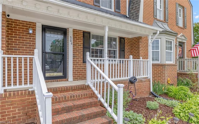 306 San Roman Dr, Chesapeake, VA 23322 - view of exterior entry with covered porch and brick siding