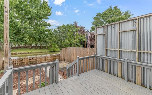 306 San Roman Dr, Chesapeake, VA 23322 - wooden terrace with a fenced backyard and a water view