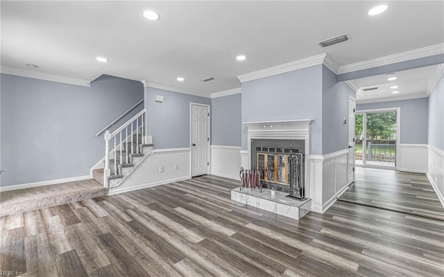306 San Roman Dr, Chesapeake, VA 23322 - unfurnished living room featuring wood finished floors, a wainscoted wall, recessed lighting, stairway, and a glass covered fireplace