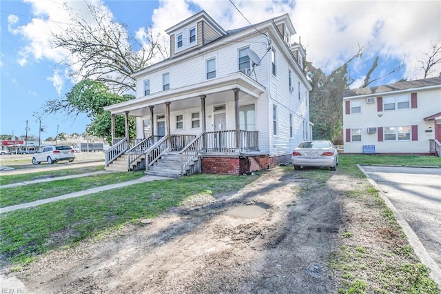 3120 Tidewater Dr, Norfolk, VA 23509 - view of front of property featuring a porch and a front yard