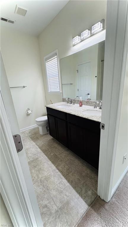 1107 Halton Ln, Chesapeake, VA 23320 - full bath with double vanity, toilet, and baseboards
