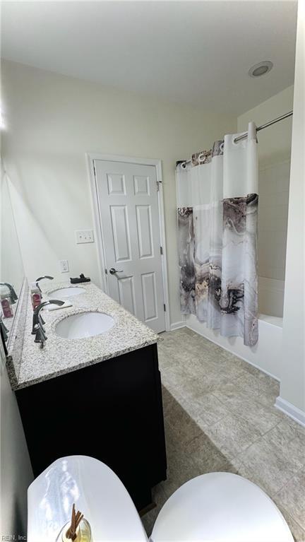 1107 Halton Ln, Chesapeake, VA 23320 - full bathroom featuring vanity, toilet, and shower / tub combo