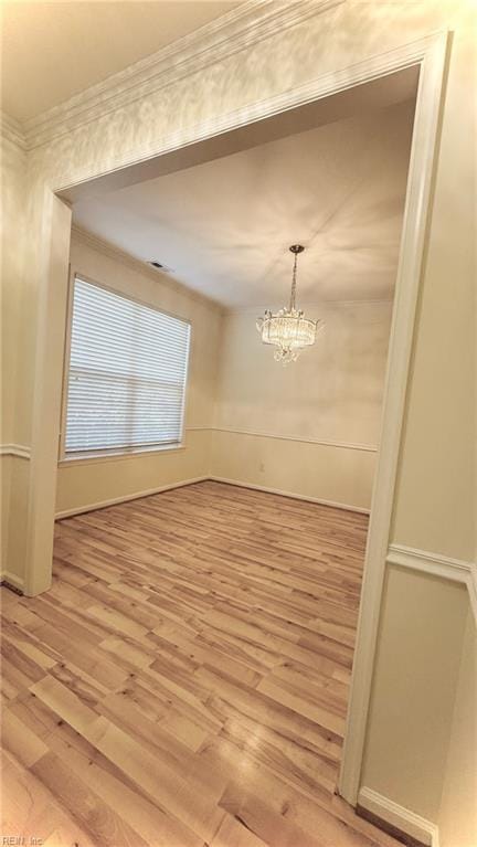 1107 Halton Ln, Chesapeake, VA 23320 - unfurnished dining area featuring light wood-style flooring, ornamental molding, and a chandelier