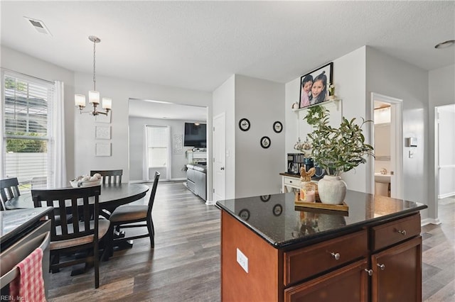 5520 White Swallow Way, Chesapeake, VA 23321 - kitchen with dark wood-style floors, a chandelier, hanging light fixtures, a textured ceiling, and dark stone countertops