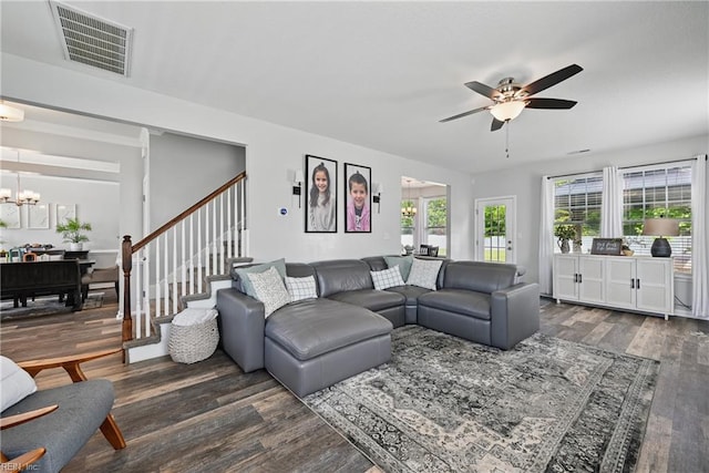 5520 White Swallow Way, Chesapeake, VA 23321 - living room featuring wood finished floors, a chandelier, a ceiling fan, and stairs