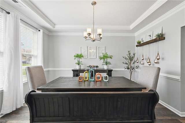 5520 White Swallow Way, Chesapeake, VA 23321 - dining room with plenty of natural light, a chandelier, dark wood-style floors, ornamental molding, and a raised ceiling