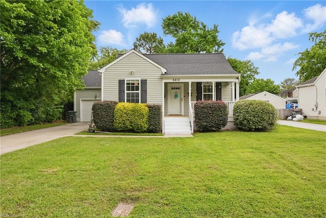 6412 Dove St, Norfolk, VA 23513 - view of front of home with an attached garage, driveway, a front yard, covered porch, and a shingled roof