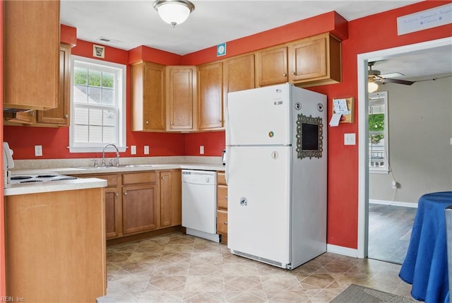 6412 Dove St, Norfolk, VA 23513 - kitchen with white appliances, a sink, light countertops, ceiling fan, and brown cabinetry