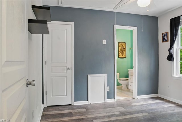 6412 Dove St, Norfolk, VA 23513 - unfurnished bedroom with attic access, wood finished floors, and baseboards