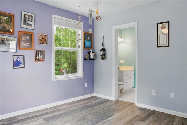 6412 Dove St, Norfolk, VA 23513 - empty room with wood finished floors and baseboards
