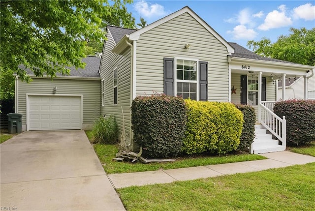 6412 Dove St, Norfolk, VA 23513 - bungalow-style home with a garage, driveway, roof with shingles, and a porch