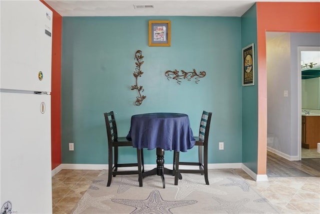 6412 Dove St, Norfolk, VA 23513 - tiled dining room featuring baseboards