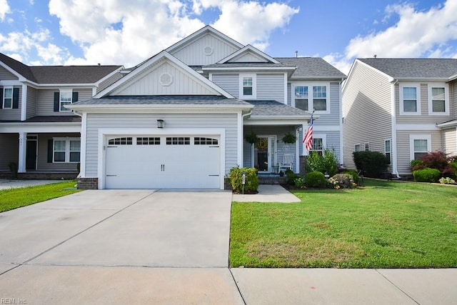 205 Markham St, Suffolk, VA 23435 - craftsman-style house featuring board and batten siding, a front yard, driveway, a garage, and covered porch
