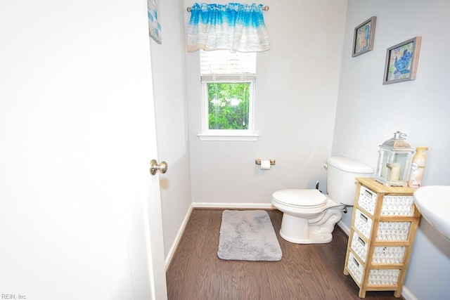 205 Markham St, Suffolk, VA 23435 - bathroom featuring toilet, wood finished floors, and baseboards