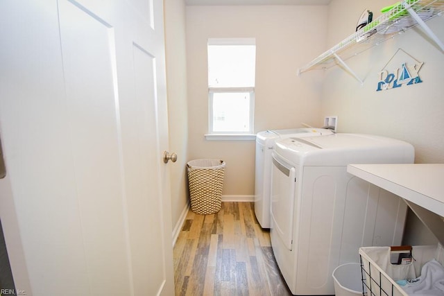 205 Markham St, Suffolk, VA 23435 - laundry room featuring separate washer and dryer, light wood-style flooring, and baseboards