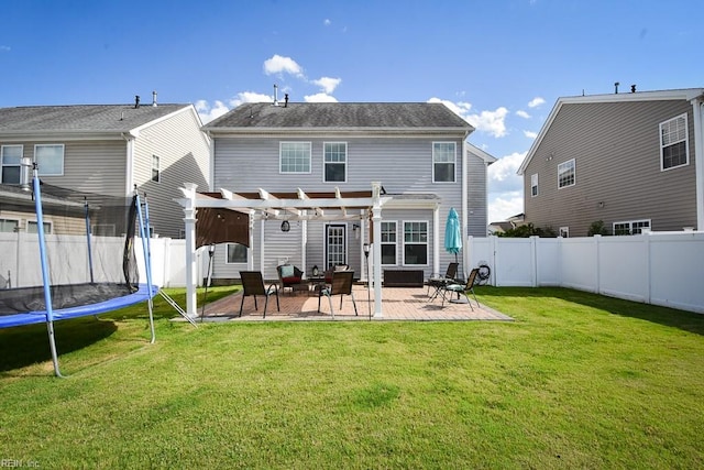 205 Markham St, Suffolk, VA 23435 - rear view of house with a pergola, a patio area, and a trampoline