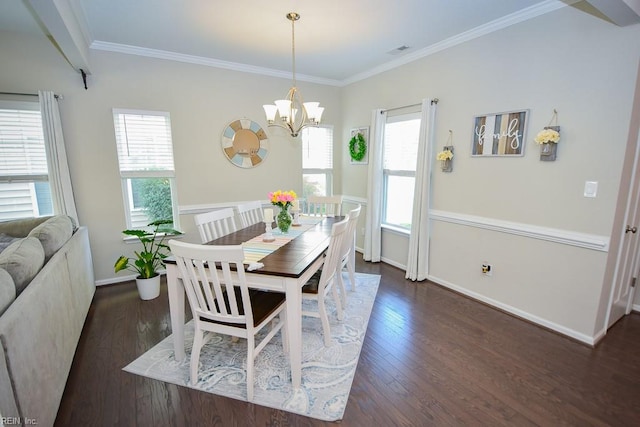 205 Markham St, Suffolk, VA 23435 - dining space with dark wood-type flooring, a chandelier, baseboards, and crown molding
